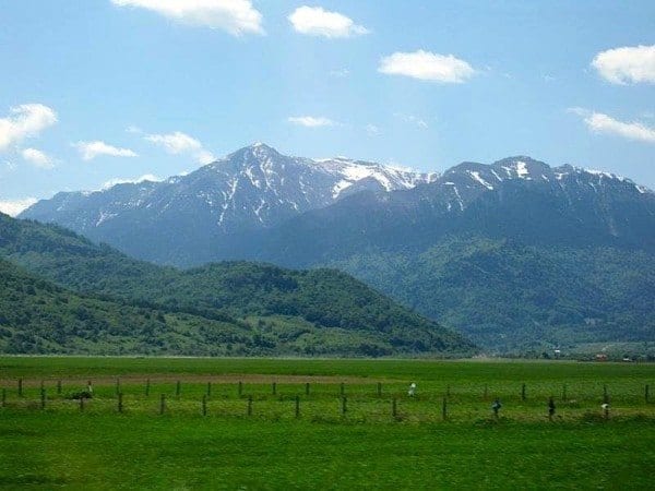 Carpathian mountain range still snow-capped in May seen from the train to Bucharest.